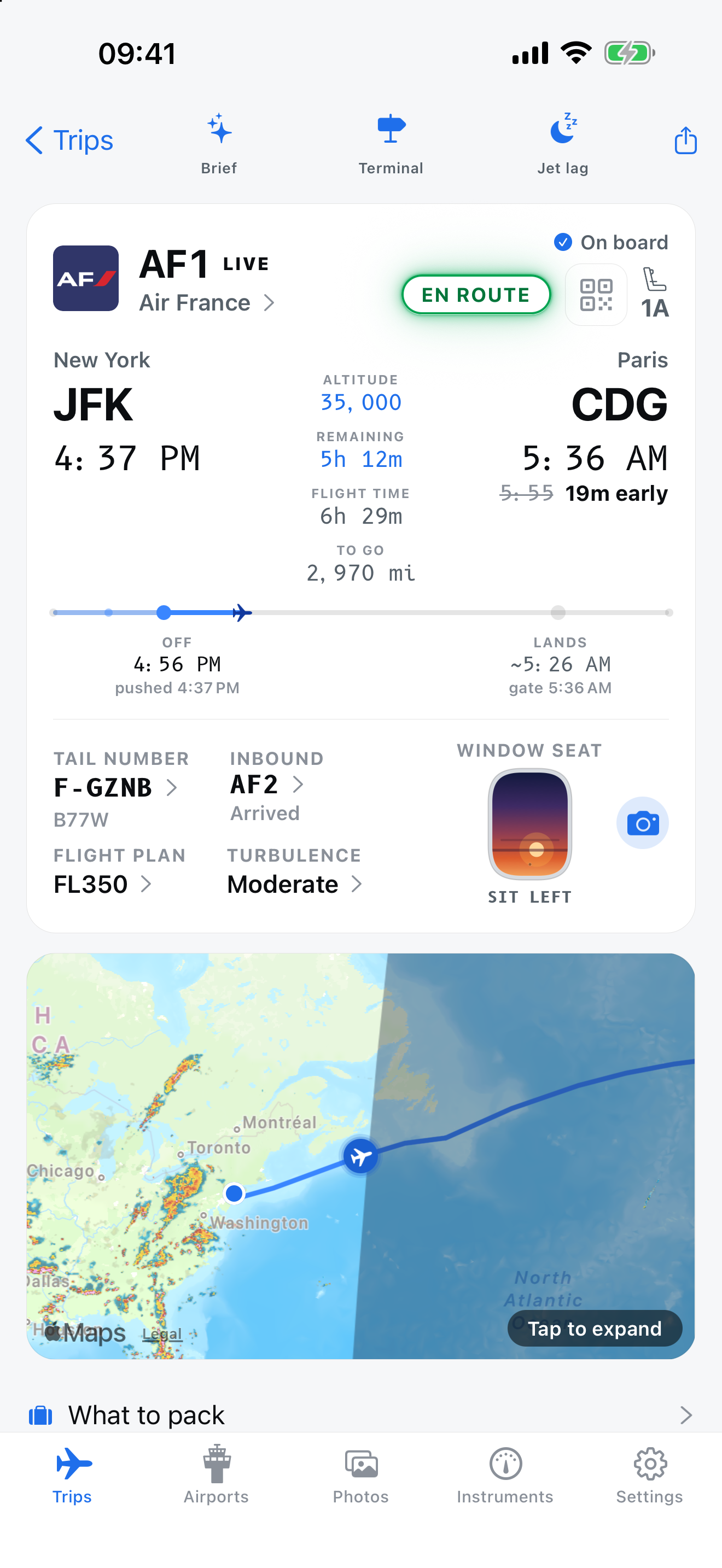 Air France AF1 from New York JFK to Paris CDG, showing flight progress, altitude, arrival estimate, window-seat advice and a route map. Captured example in day mode.