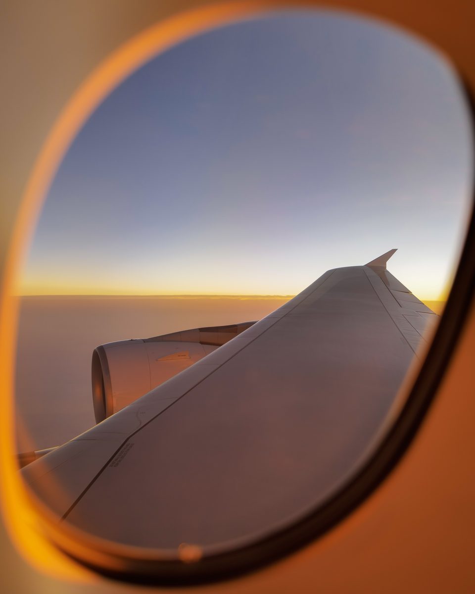 Golden light through an Emirates aircraft window over Ash Sayyit, Saudi Arabia, on EK212 from Houston to Dubai